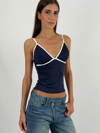 Top Blu con Bordo a Contrasto - Top cropped blu in tessuto elasticizzato, con coppe preformate e bordi a contrasto. | Paloma Store